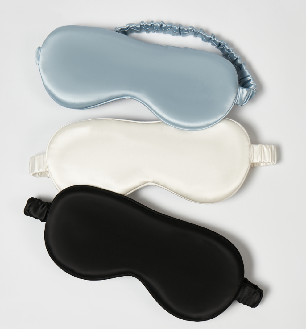 White silk eye mask styled on a model