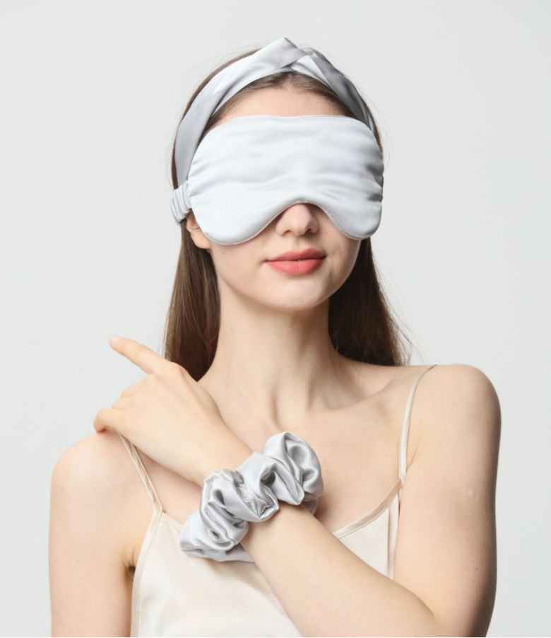 White silk eye mask styled on a model
