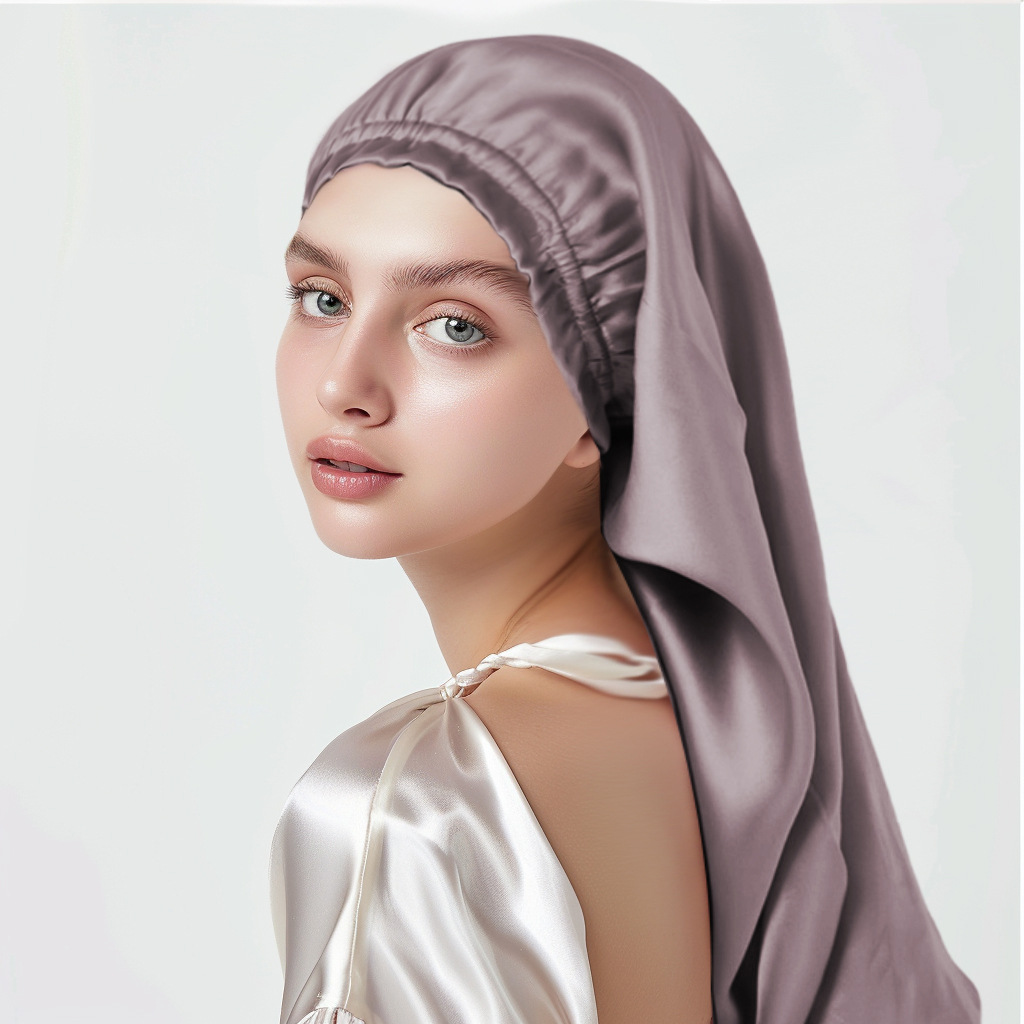 Model wearing a long pink silk hair wrap